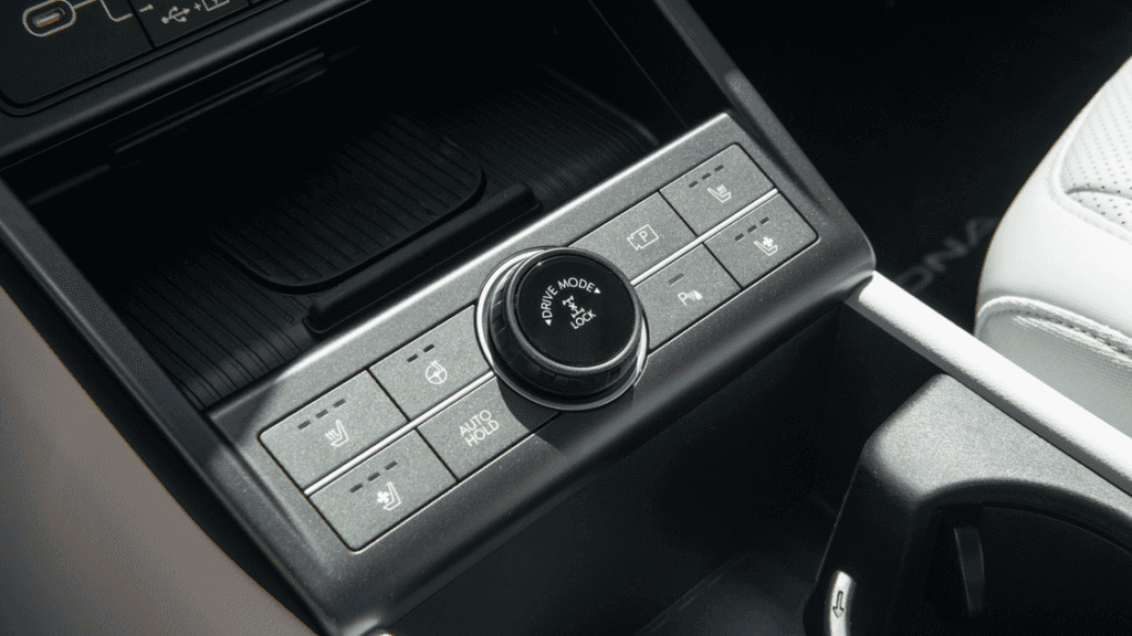 Center console drive mode selector and heated seat controls in the 2025 Hyundai Kona interior.
