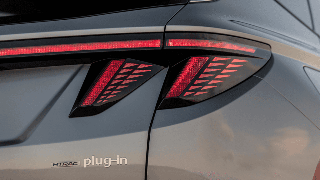 Close-up of 2025 Hyundai Tucson Plug-in Hybrid tail light with HTRAC and plug-in badging.