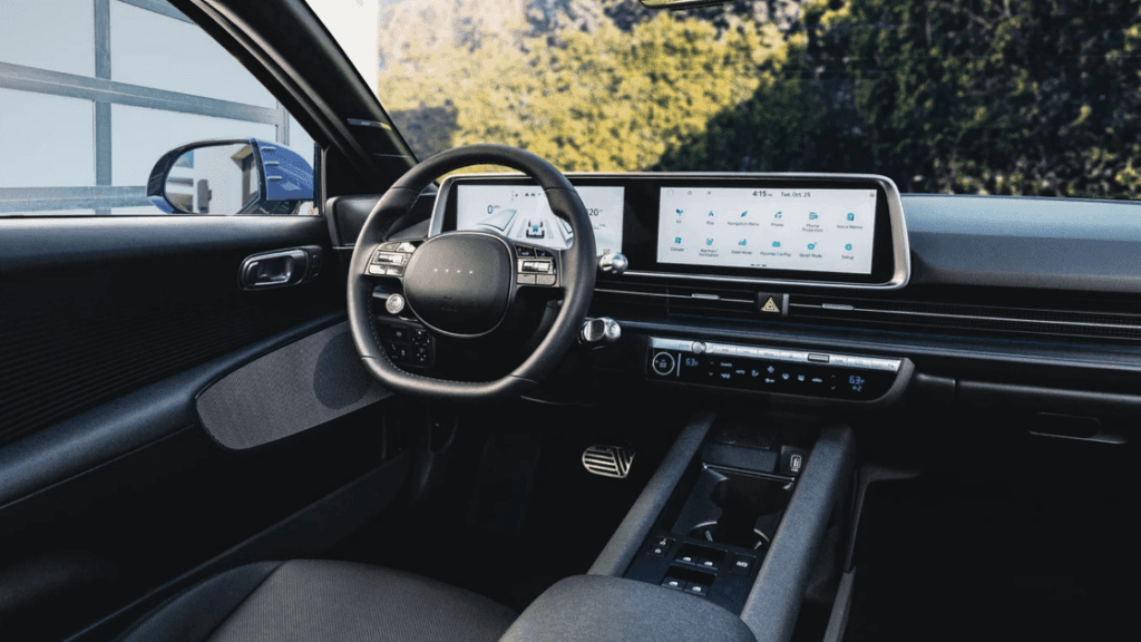 Cockpit view of 2025 Hyundai IONIQ 6 interior showing digital dashboard and infotainment screens.