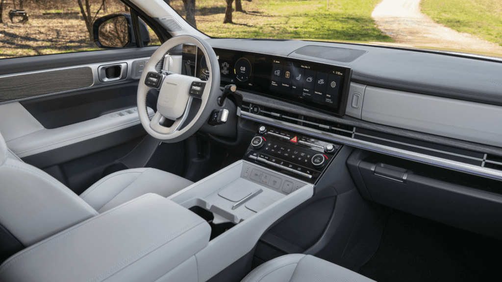 2026 Hyundai Santa Fe interior with modern steering wheel, dual digital displays, and premium trim.