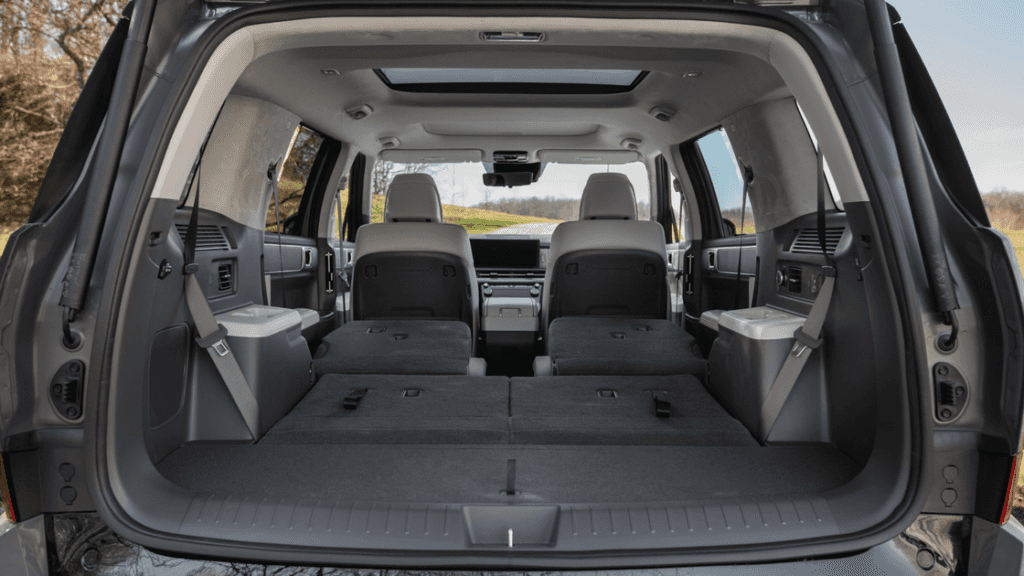 2026 Hyundai Santa Fe rear cargo view with folded seats showing expanded flat storage space.