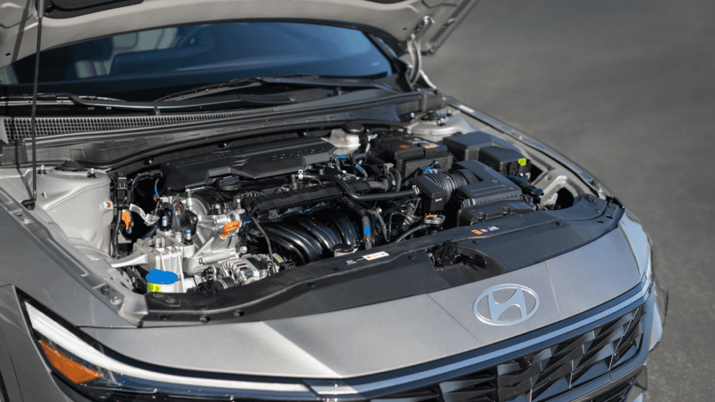 2025 Hyundai Elantra engine bay view highlighting components under the hood with open bonnet.
