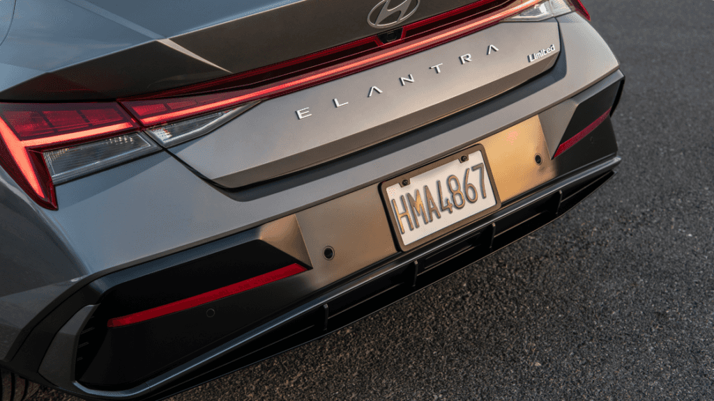 2025 Hyundai Elantra rear view with Limited badge and LED taillights in daylight setting.