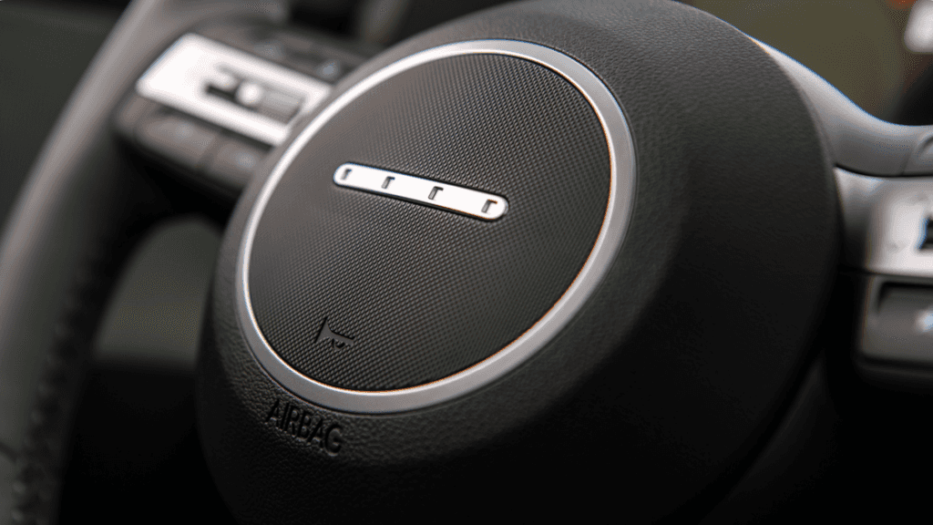 2025 Hyundai Kona Electric steering wheel close-up with textured center design.