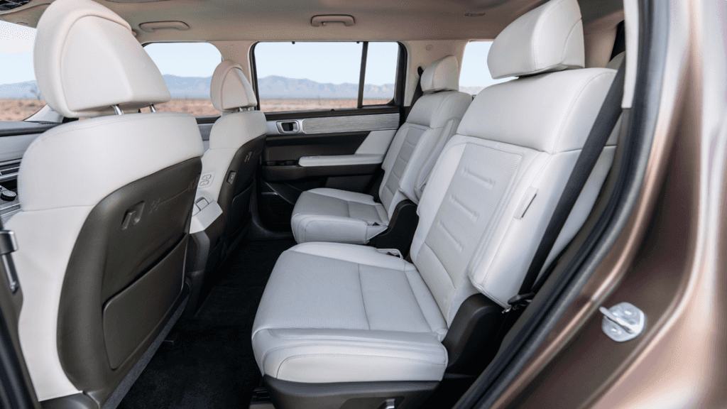 2025 Hyundai Santa Fe Hybrid second-row captain’s chairs in light leather interior.