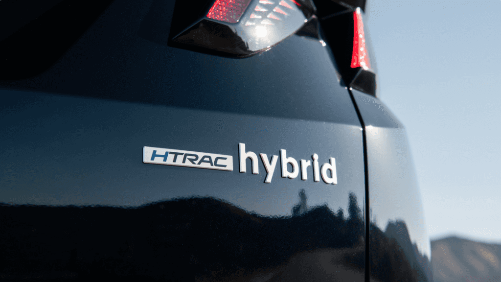 2025 Hyundai Tucson Hybrid HTRAC hybrid badge on rear exterior in sunlight.