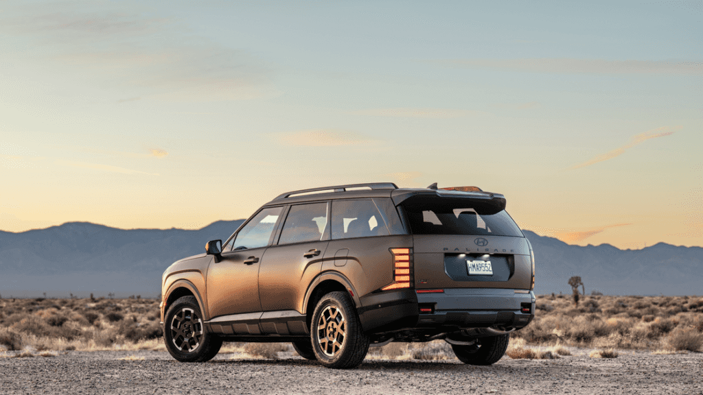 2026 Hyundai Palisade rear exterior parked in desert landscape with LED taillights.