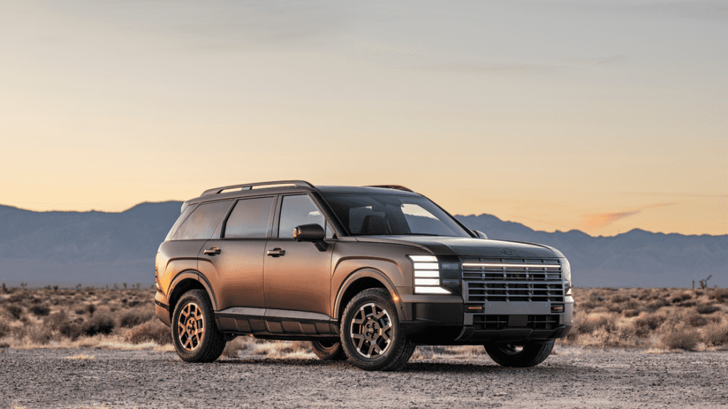 2026 Hyundai Palisade SUV parked at sunset highlighting rugged stance and premium exterior details.