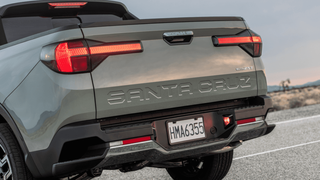 2026 Hyundai Santa Cruz tailgate close-up showing embossed branding and rear lighting.