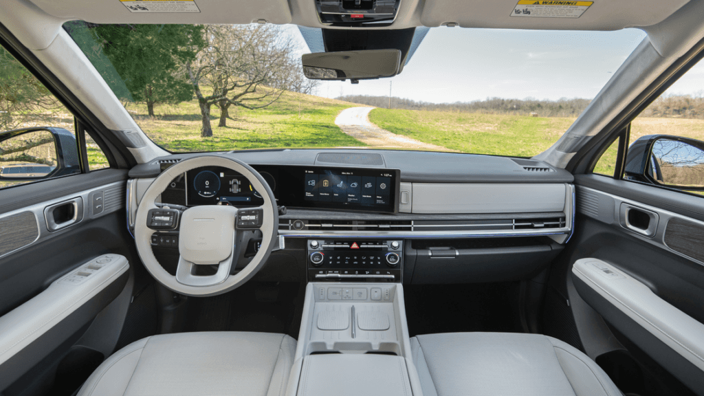 2026 Hyundai Santa Fe interior view highlighting center console, touchscreen, and driver cockpit.