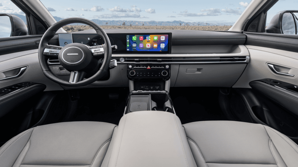 2026 Hyundai Tucson interior featuring digital instrument cluster and modern dashboard layout.