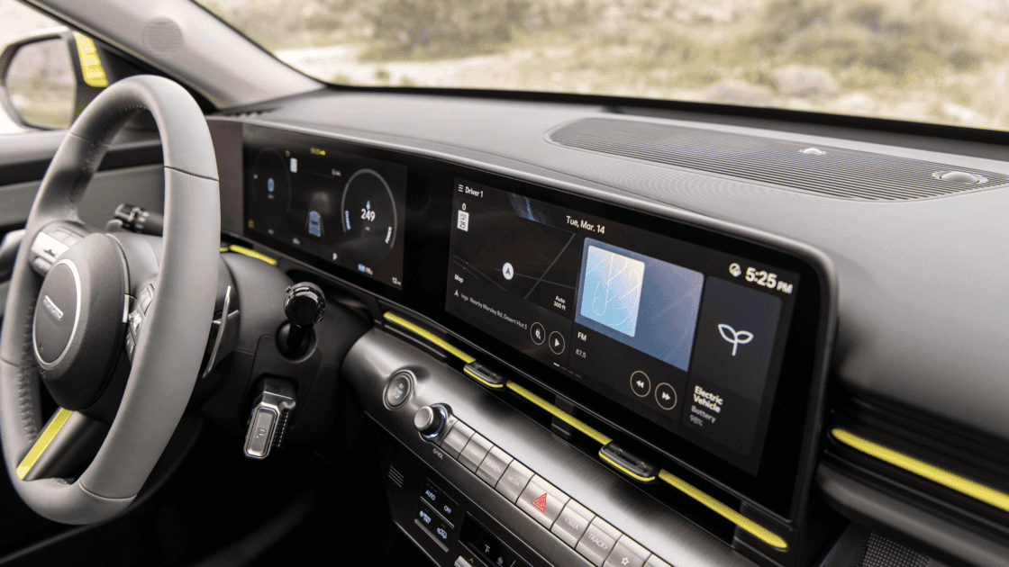 Interior dashboard view of the 2026 Hyundai Kona Electric displaying wide digital screens, infotainment system, and modern EV cockpit layout.