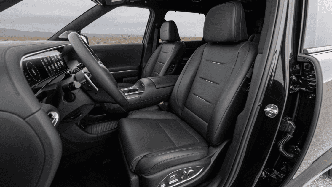 Front interior view of the 2026 Hyundai Palisade featuring a wide digital dashboard, center touchscreen, and upscale cabin layout.