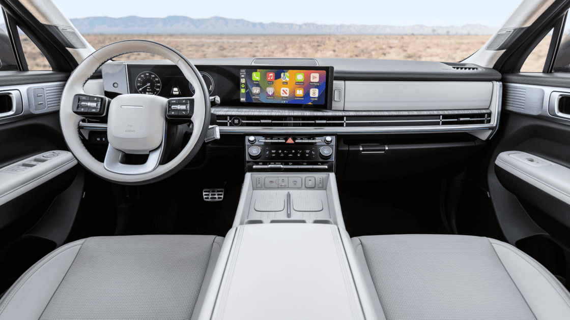 Interior seating view of the 2026 Hyundai Santa Fe Hybrid highlighting light upholstery, wide cabin space, and premium comfort features.
