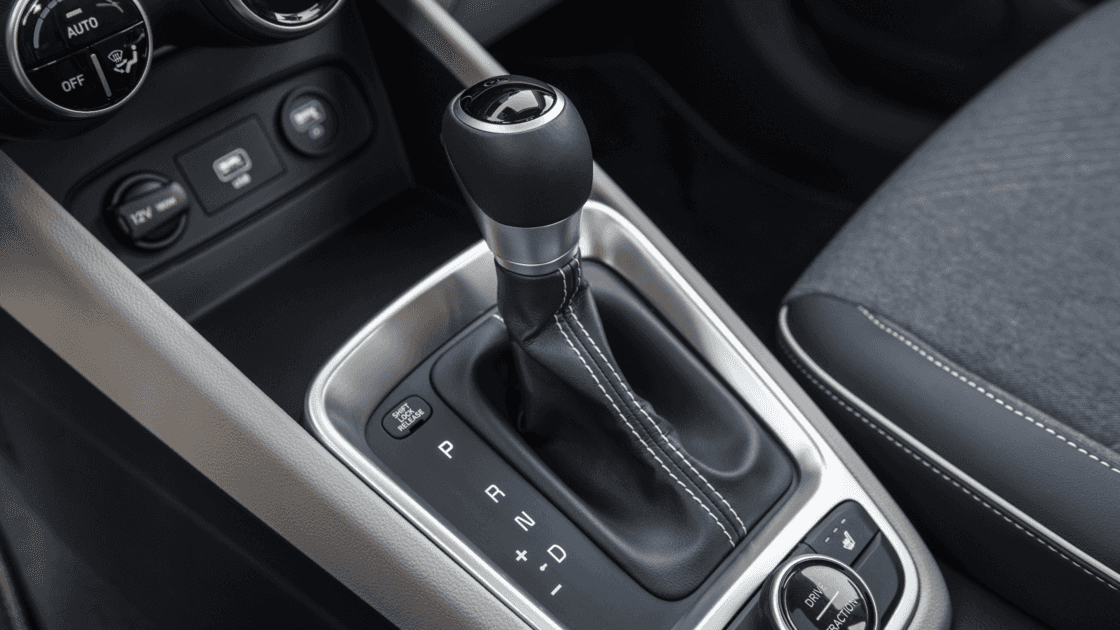 Close up view of the 2026 Hyundai Venue gear shifter and center console featuring drive mode selector and practical interior controls.