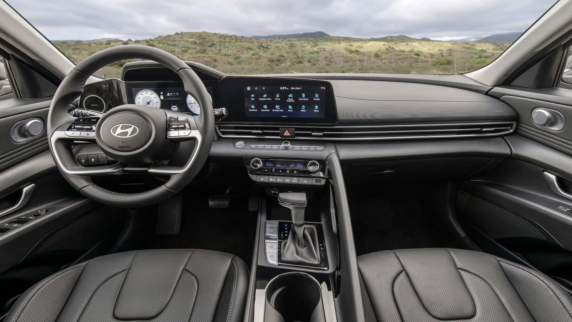 2026 Hyundai Elantra interior dashboard with digital gauge cluster, wide touchscreen display, leather seats, and modern center console layout.