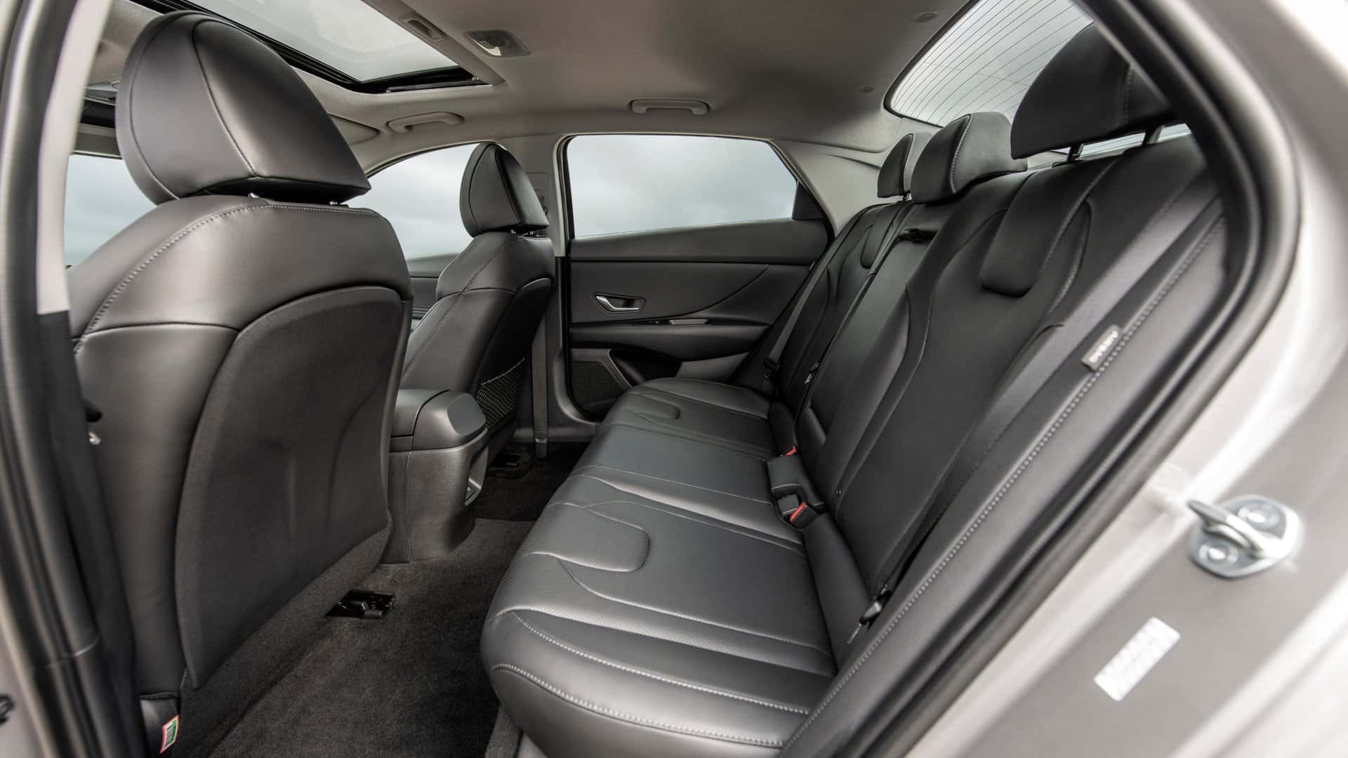 2026 Hyundai Elantra rear seat interior featuring black leather upholstery, spacious legroom, and contoured seating for passengers.