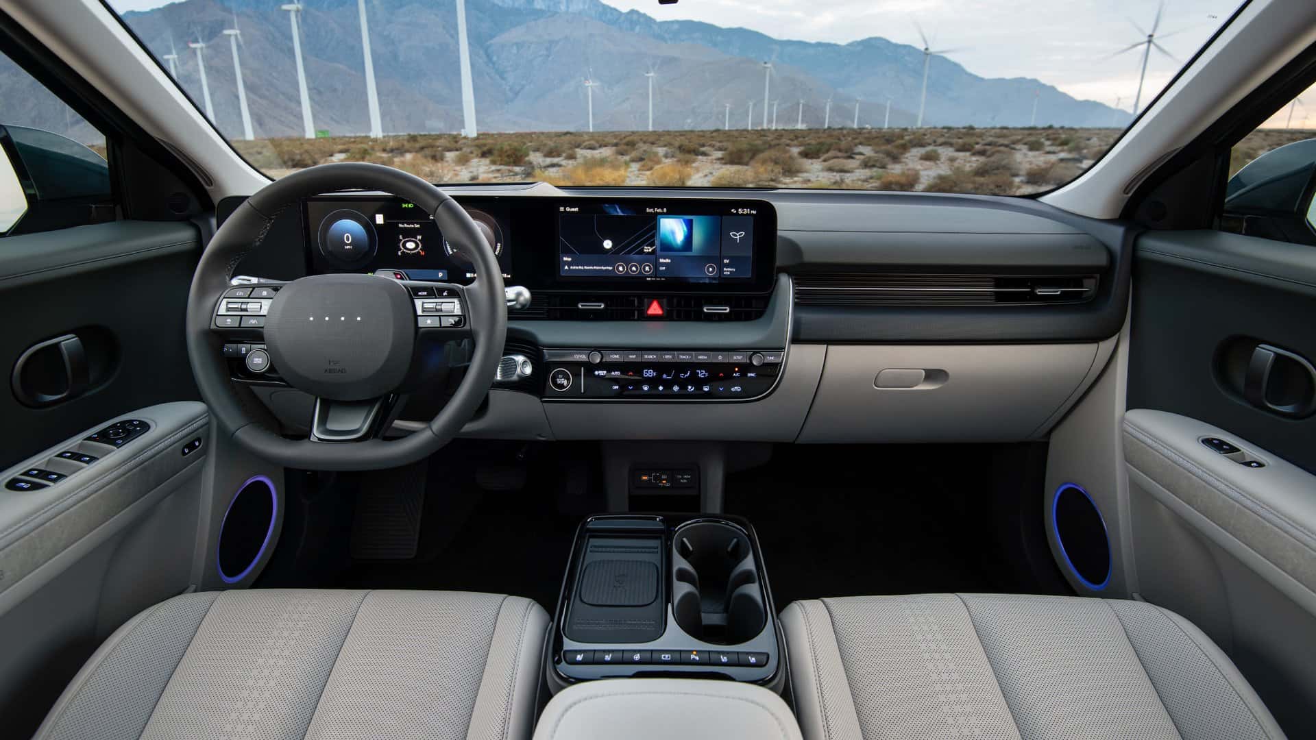 2026 Hyundai IONIQ 5 interior dashboard with dual digital displays, minimalist EV cockpit, ambient lighting, and center console storage.