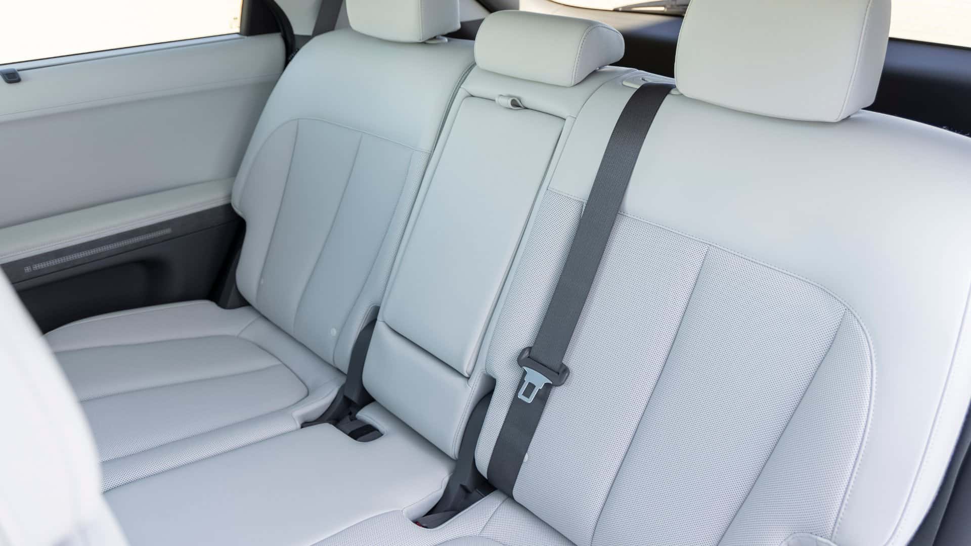 2026 Hyundai IONIQ 5 rear seat interior with light gray upholstery, flat floor design, and adjustable seating for electric vehicle comfort.