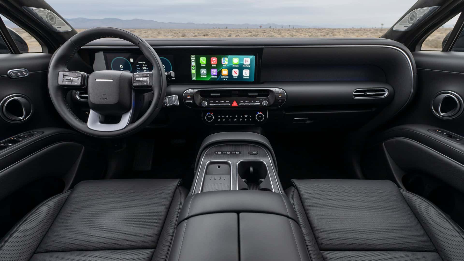 Wide interior dashboard view of the 2026 Hyundai Palisade showing digital instrument cluster, infotainment screen, steering wheel, and center console.