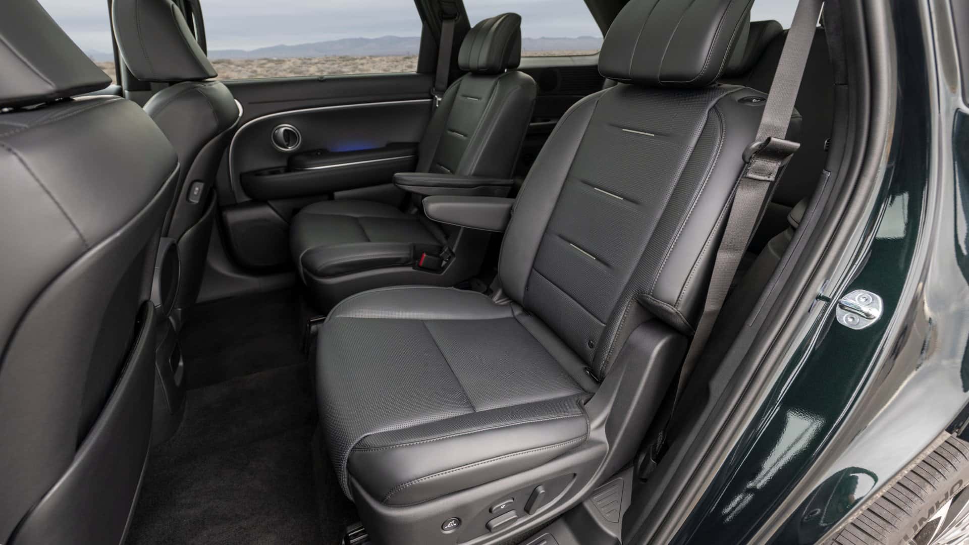 Second-row captain’s chairs in the 2026 Hyundai Palisade featuring leather seats, fold-down armrests, and spacious rear passenger area.