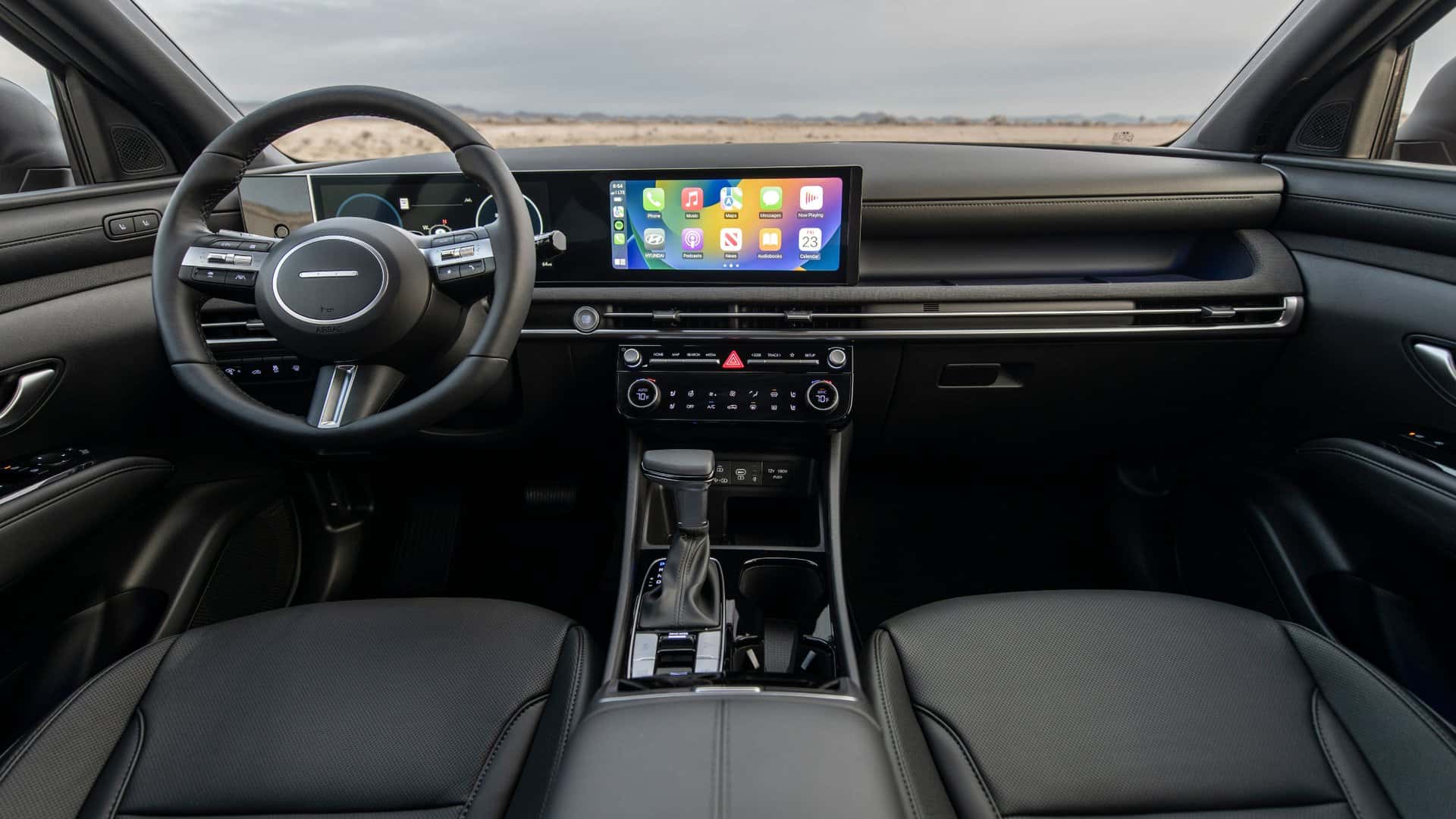 2026 Hyundai Santa Cruz interior cockpit view showing digital instrument cluster, touchscreen infotainment system, and modern center console.