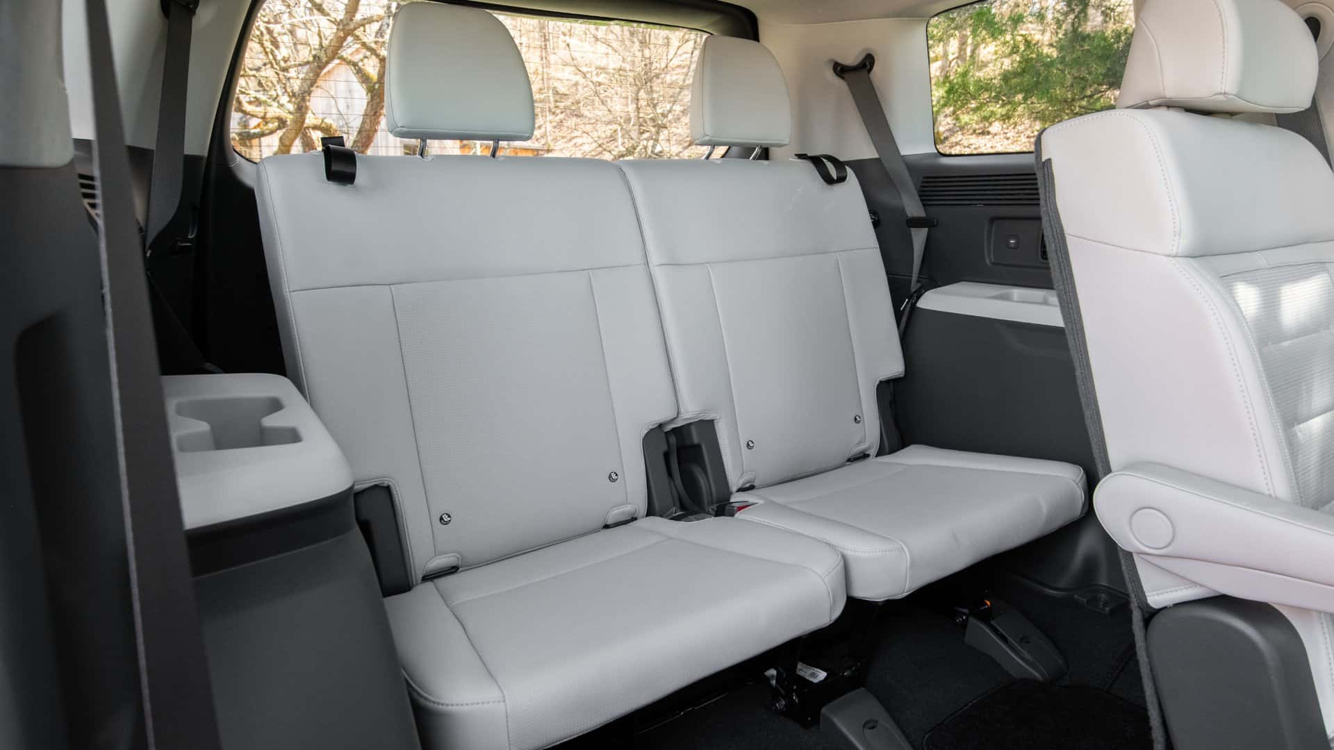 2026 Hyundai Santa Cruz rear passenger seating area with contoured seats, modern door panels, and comfortable compact truck interior.