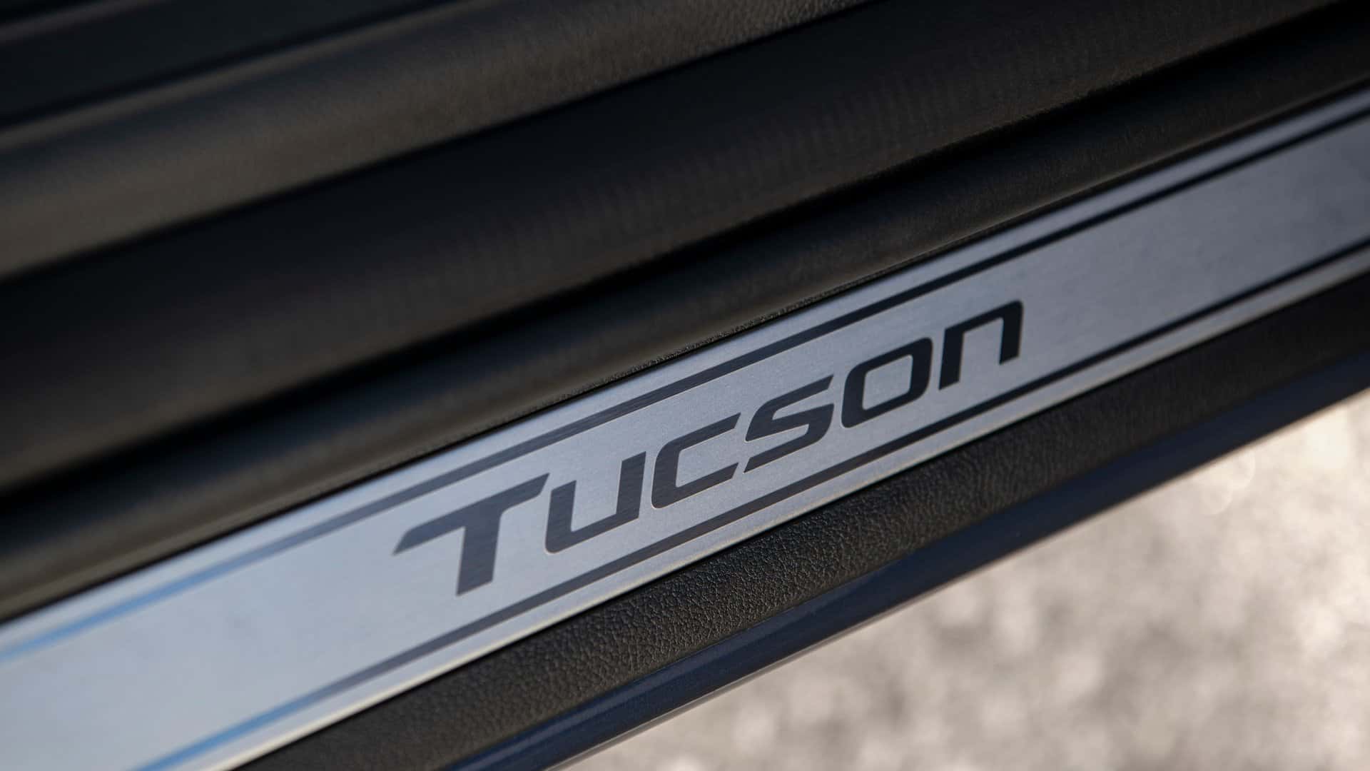2026 Hyundai Tucson door sill close-up displaying Tucson badging and premium interior trim finish.