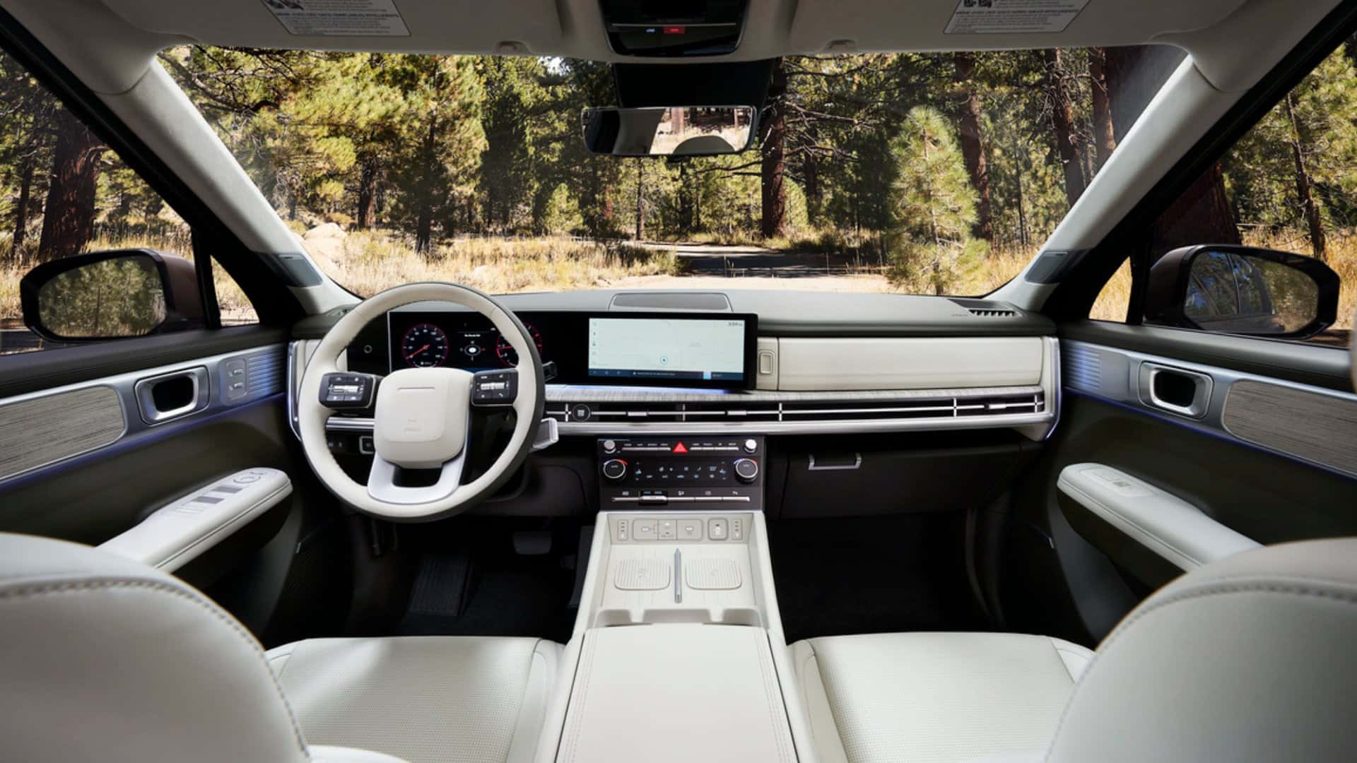 2026 Hyundai Santa Fe Hybrid interior cabin with wide infotainment screen and premium materials.