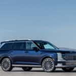 2026 Hyundai Palisade SUV parked in side profile with dark exterior and large alloy wheels.