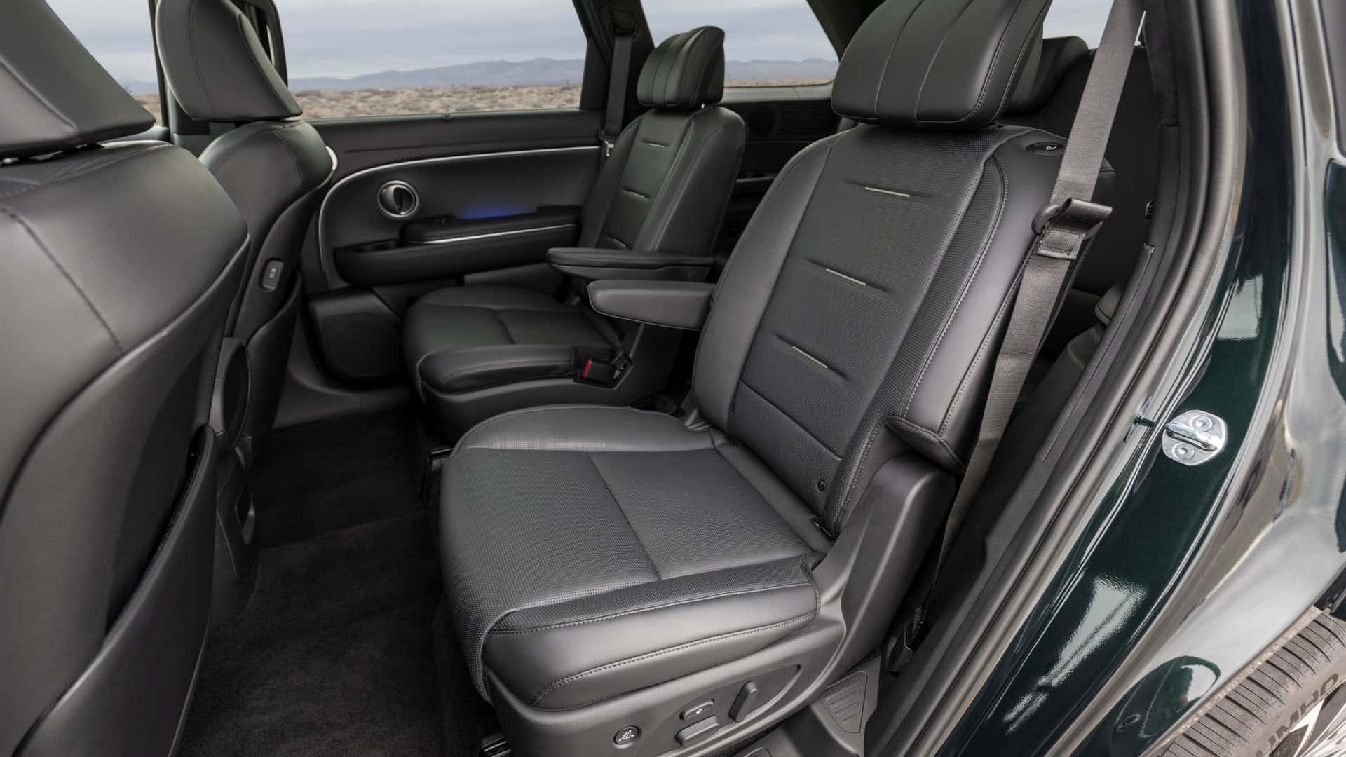 2026 Hyundai Palisade second row captain chairs with black leather seating and armrests.