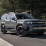 2026 Hyundai Santa Fe SUV parked in front three quarter view with gray exterior and black wheels.