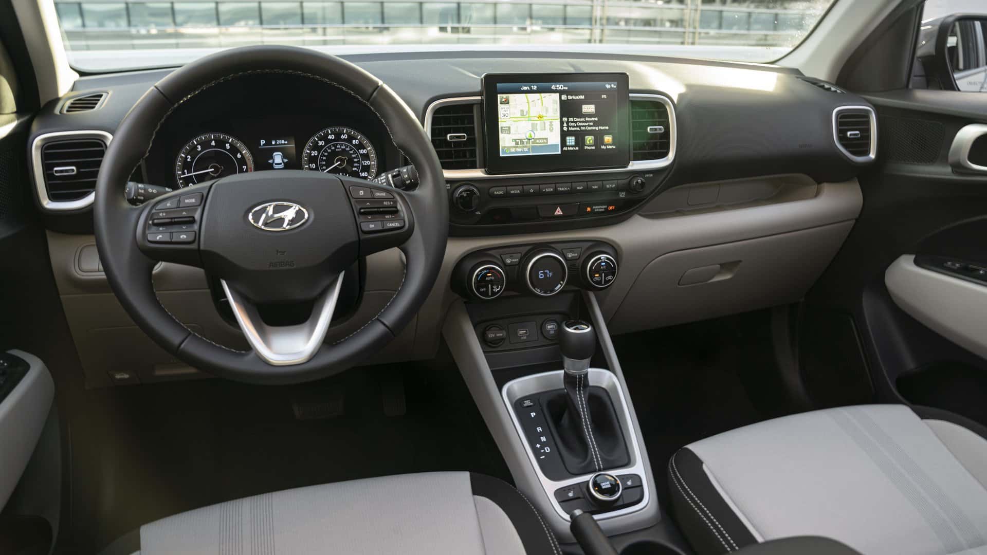2026 Hyundai Venue interior dashboard with touchscreen display steering wheel and center console.