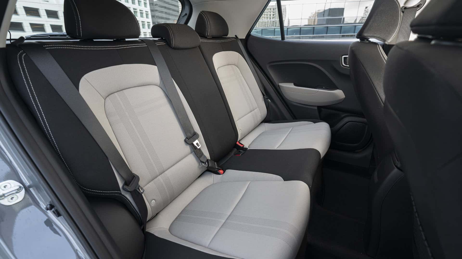 2026 Hyundai Venue rear seat interior with two tone upholstery and passenger legroom.