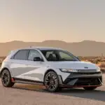 2026 Hyundai IONIQ 5 N white electric SUV parked in desert landscape with sport wheels and red trim.