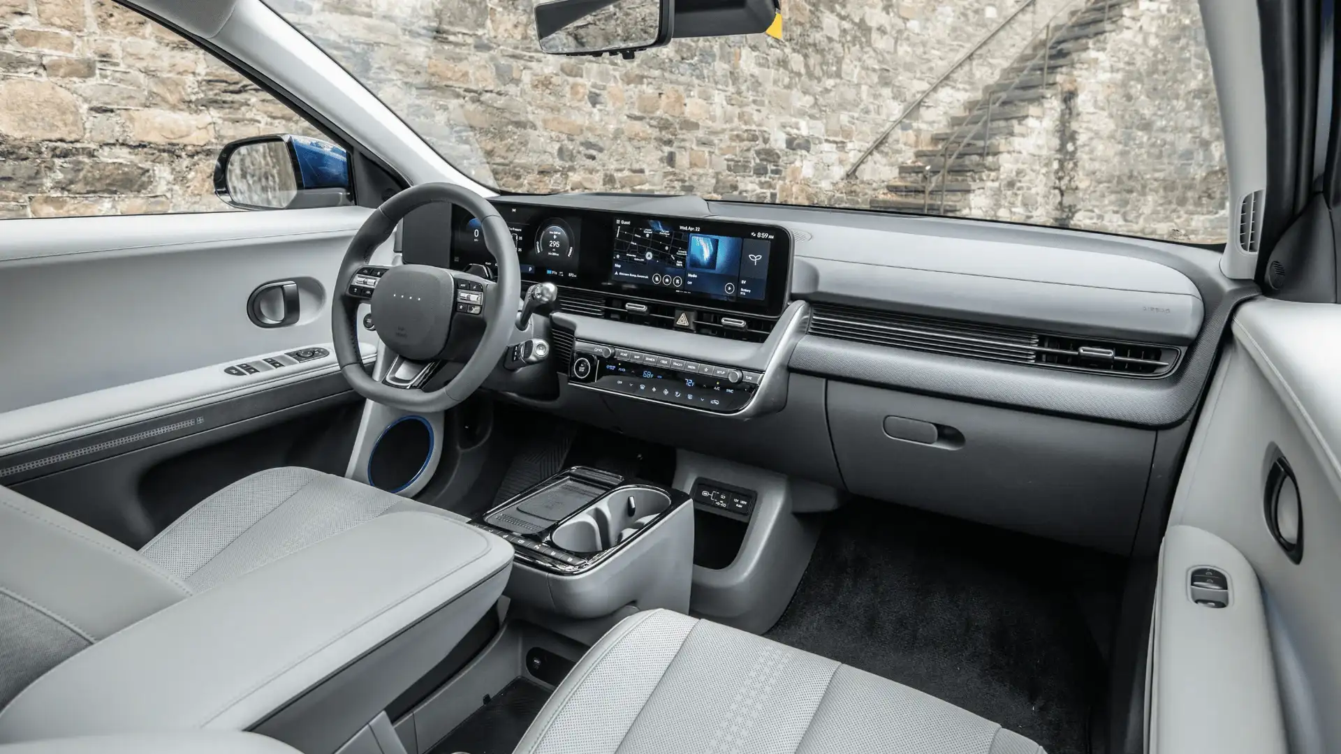 2026 Hyundai IONIQ 5 interior with wide digital display, light seats, and modern dashboard.