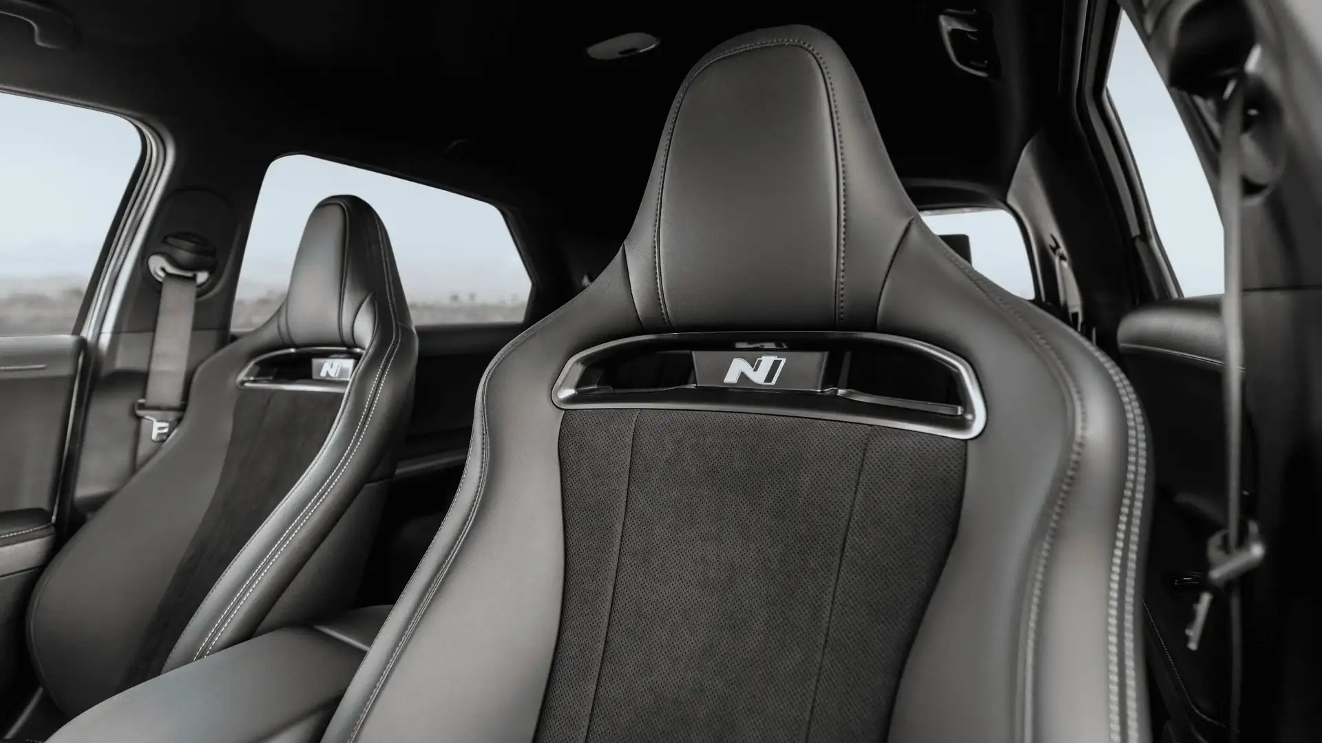 2026 Hyundai IONIQ 5 N front sport seats with black upholstery, N badging, and contrast stitching.
