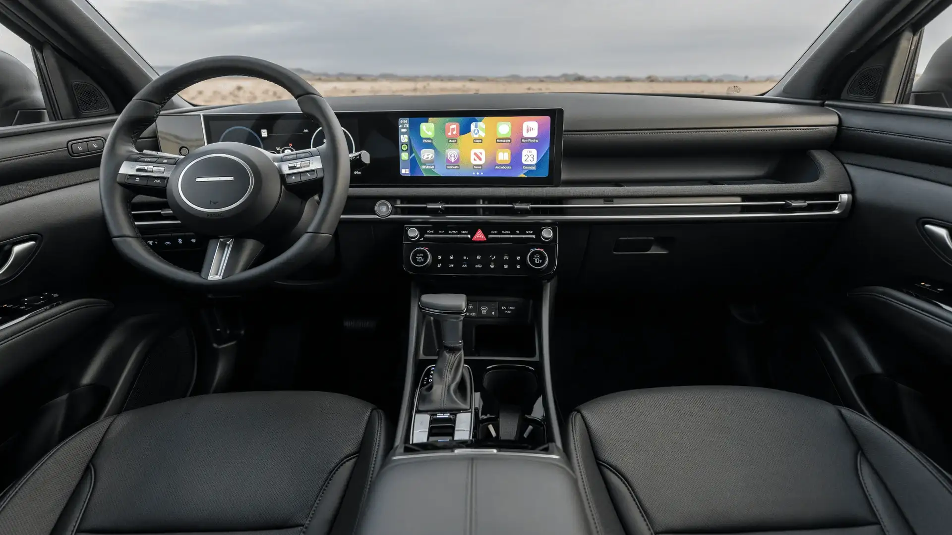 2026 Hyundai Santa Cruz cabin with digital display, center console, and light interior trim.