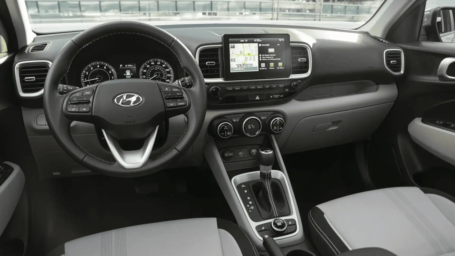 2026 Hyundai Venue interior with touchscreen display, steering wheel, and two-tone seats.
