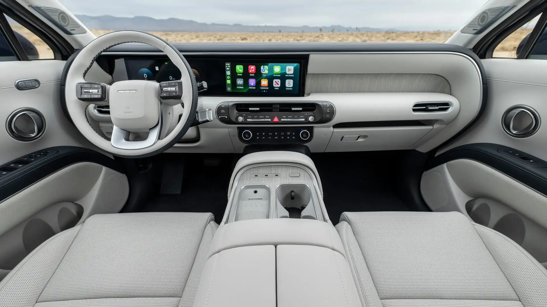 2027 Hyundai Palisade dashboard with digital screens, light cabin trim, and wide center console.