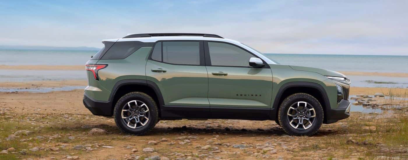 A green 2025 Chevy Equinox ACTIV is shown parked after visiting a Chevy dealer near Exeter.