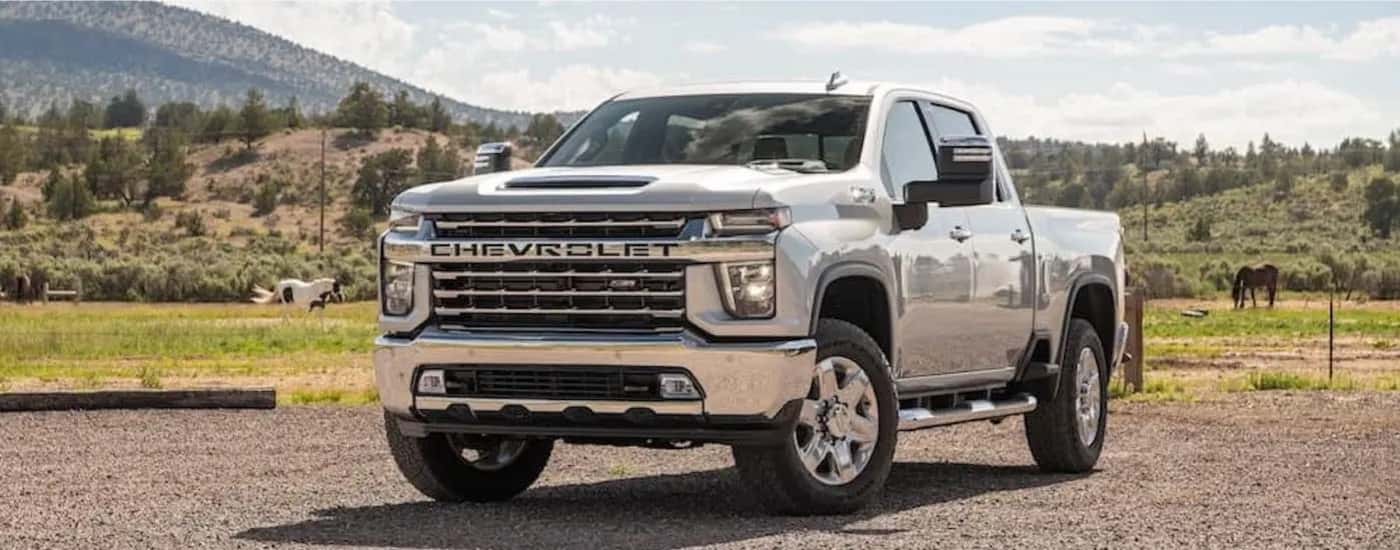 A silver 2022 Chevy Silverado 2500 HD is shown from the front at an angle.
