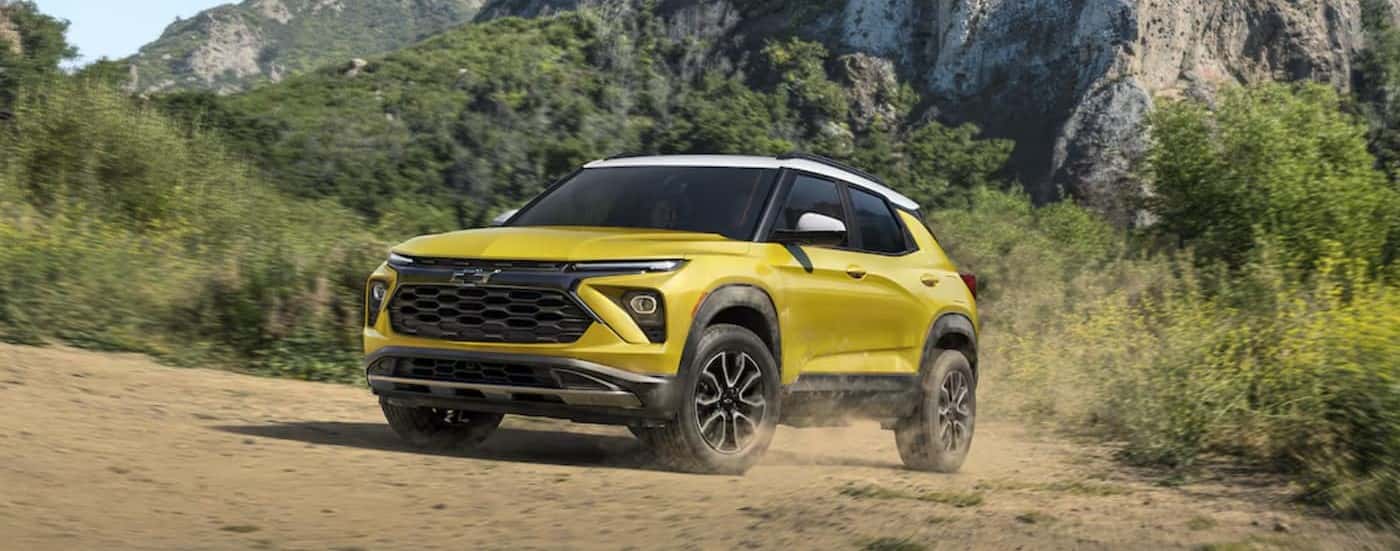 A yellow 2024 Chevy Trailblazer ACTIV off-roading.