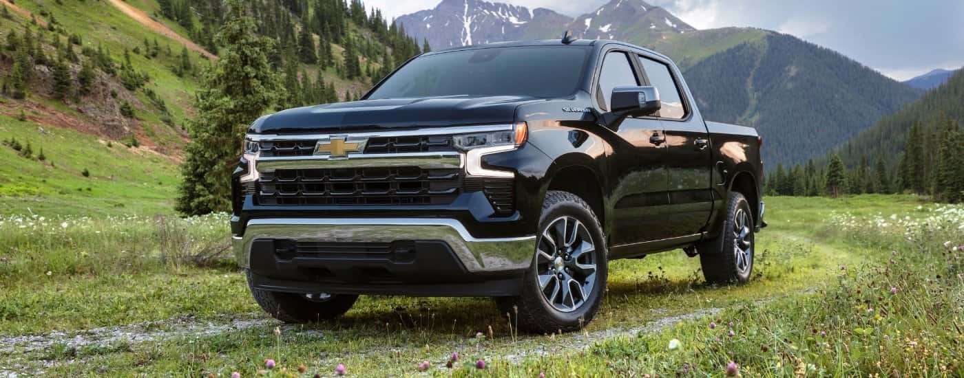A black 2025 Chevy Silverado 1500 from the front at an angle.