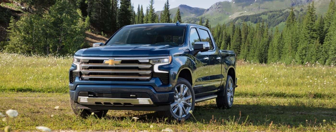 A blue 2025 Chevy Silverado 1500 for sale near Danville from the front at an angle.