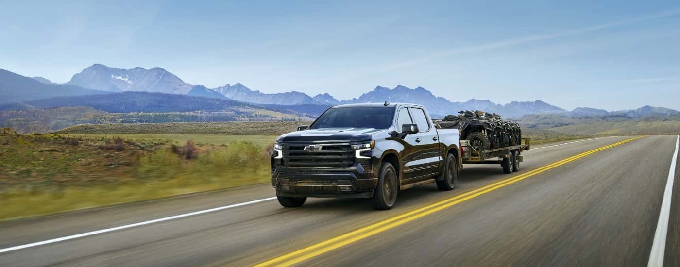 A black 2025 Chevy Silverado 1500 from the front.