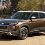 Brown and white 2021 Chevy Trailblazer parked by a body of water