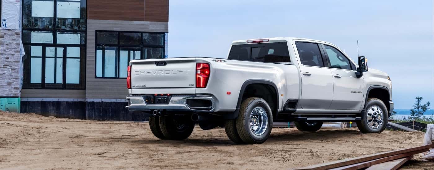A black 2025 Chevy Silverado 3500 from the rear at an angle.