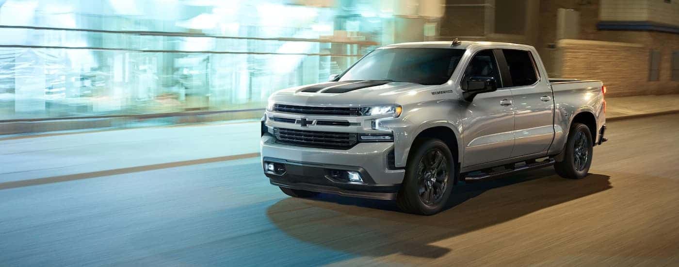 A city driving silver 2023 Chevy Silverado 1500 for sale near Ipswich.