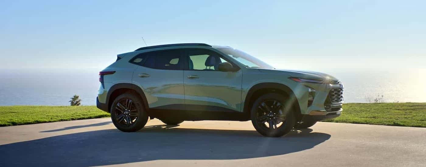 A green 2024 Chevy Trax parked on a sunny day.